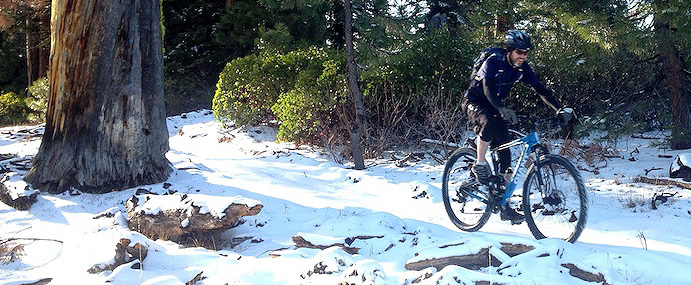 riding mountain bike in snow